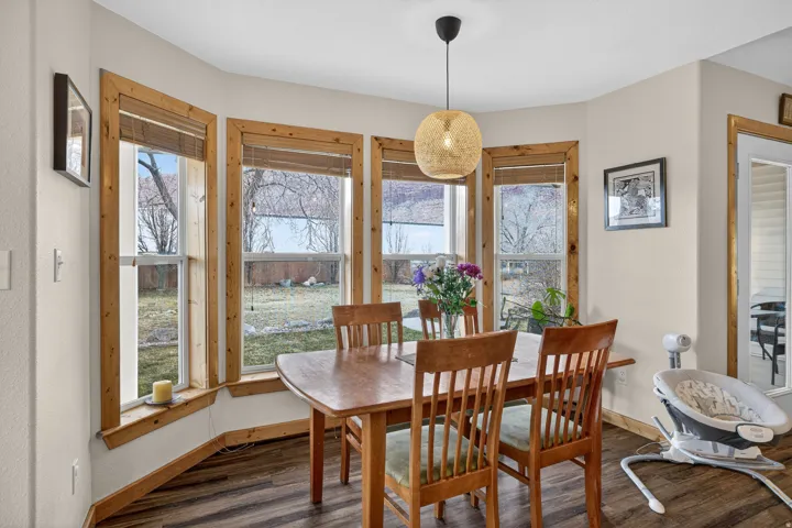 Dining area featuring baseboards and wood finished floors