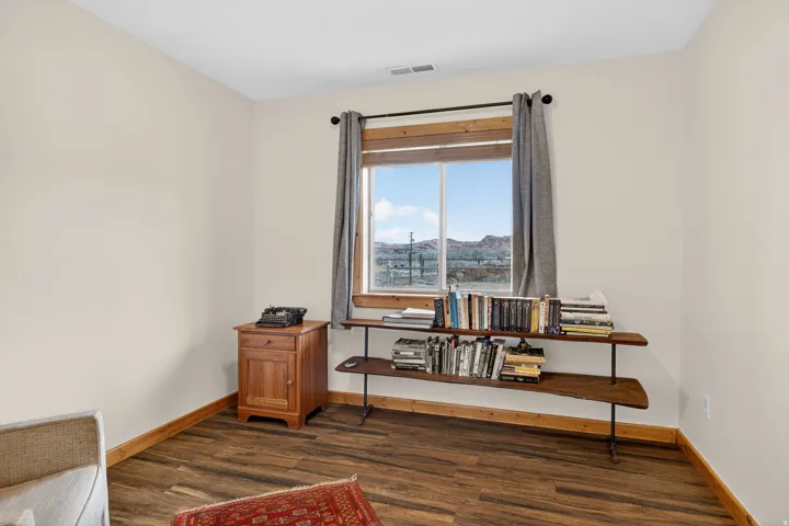 Living area featuring dark wood-type flooring and a mountain view