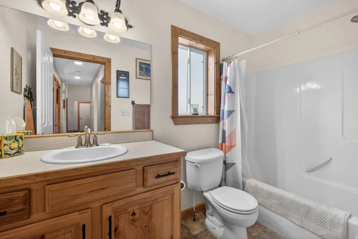 Bathroom with vanity and shower / bath combo