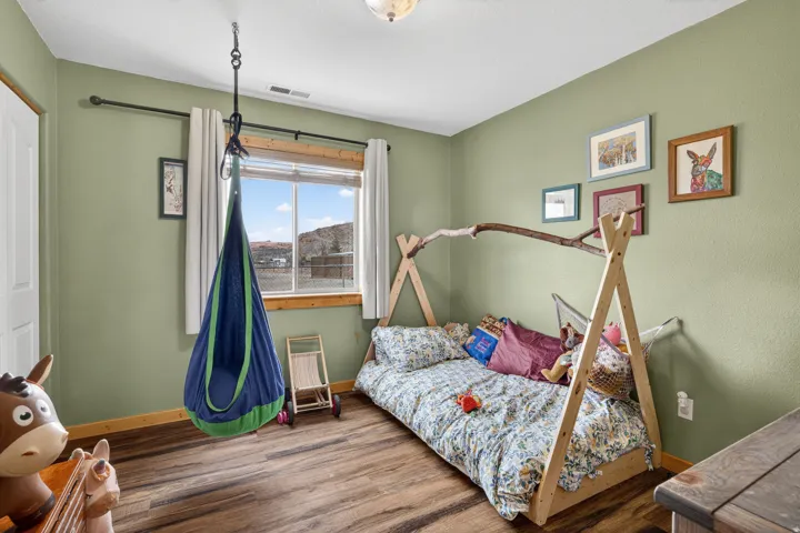 Bedroom with wood finished floors