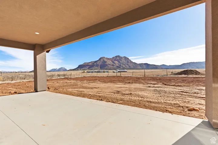 View of patio / terrace with a mountain view and a view of rural / pastoral area