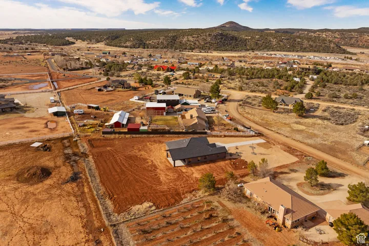 Aerial view of property's location featuring nearby suburban area and rural landscape