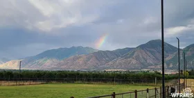 View of mountain background featuring rural landscape