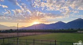 View of mountain background featuring rural landscape and agricultural land