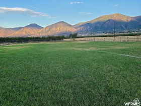 View of mountain background with rural landscape and agricultural land