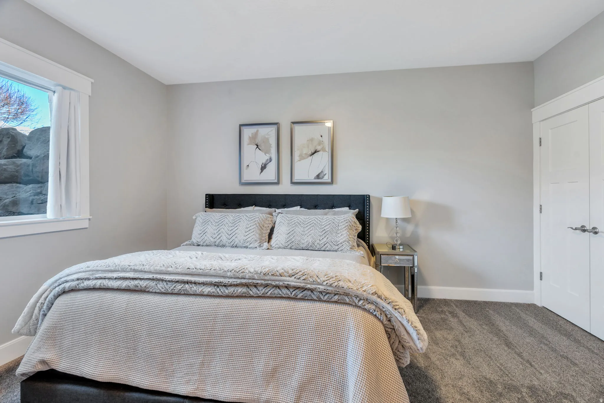 Downstairs bedroom with  carpet