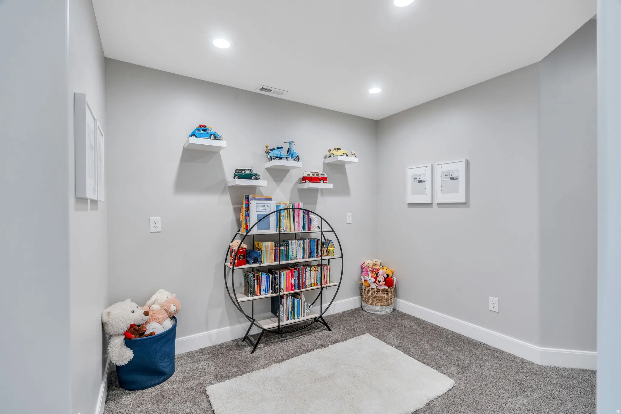Downstairs nook with carpet and recessed lighting
