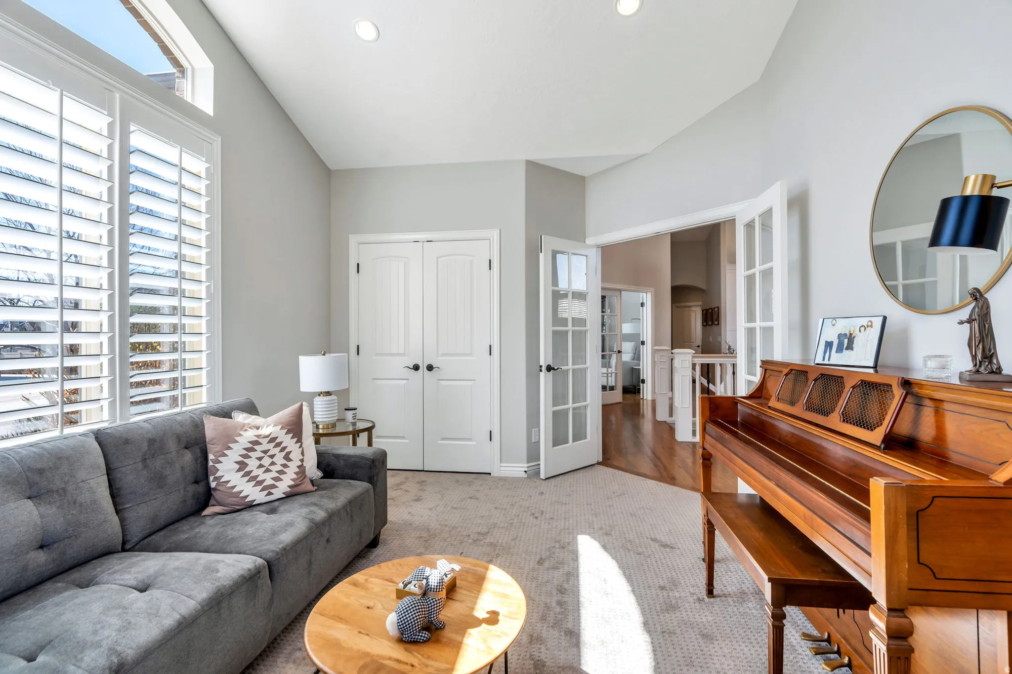 Bedroom being used as a den, with  carpet, French doors, and recessed lighting