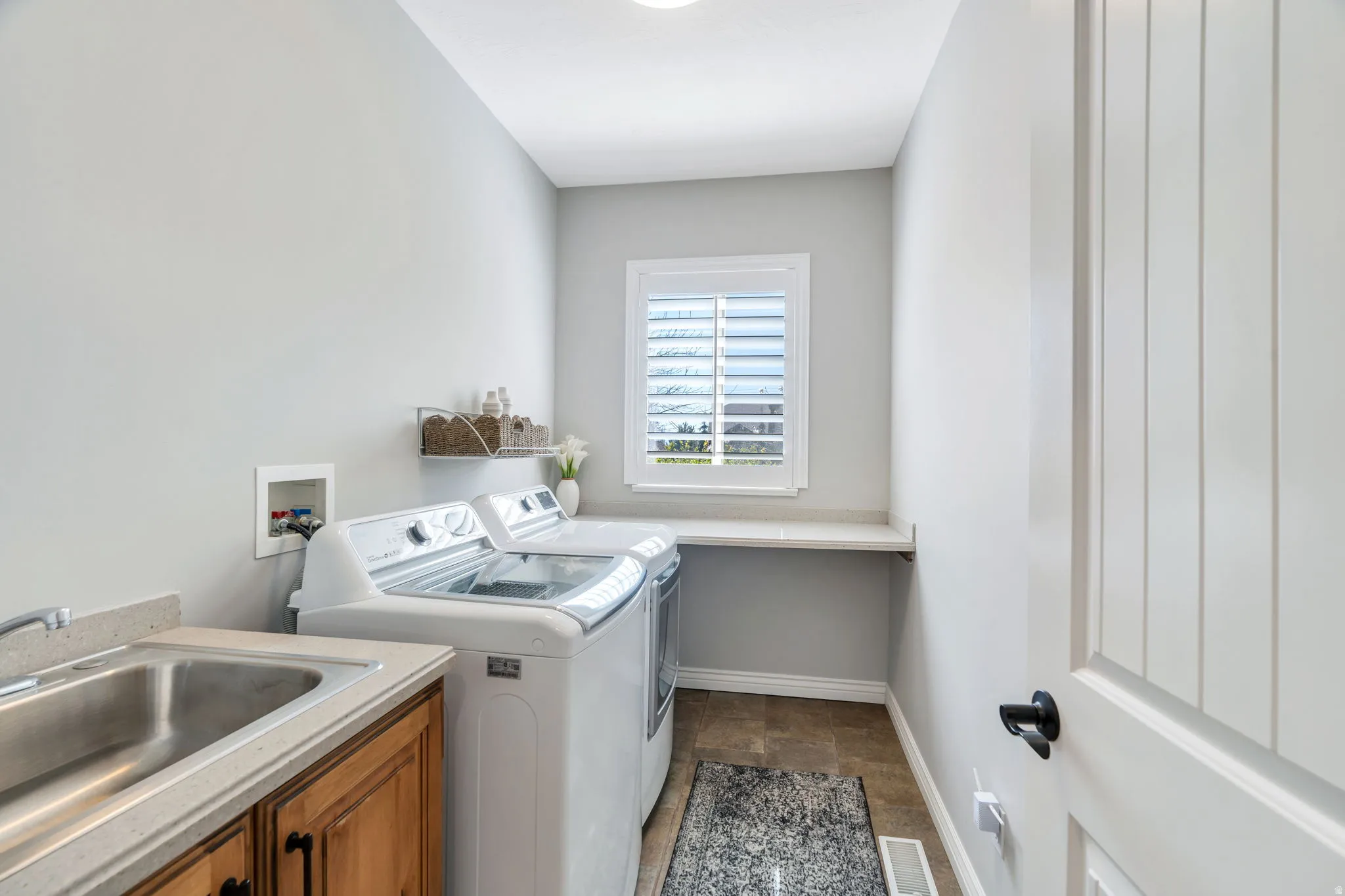 Laundry room with tile flooring