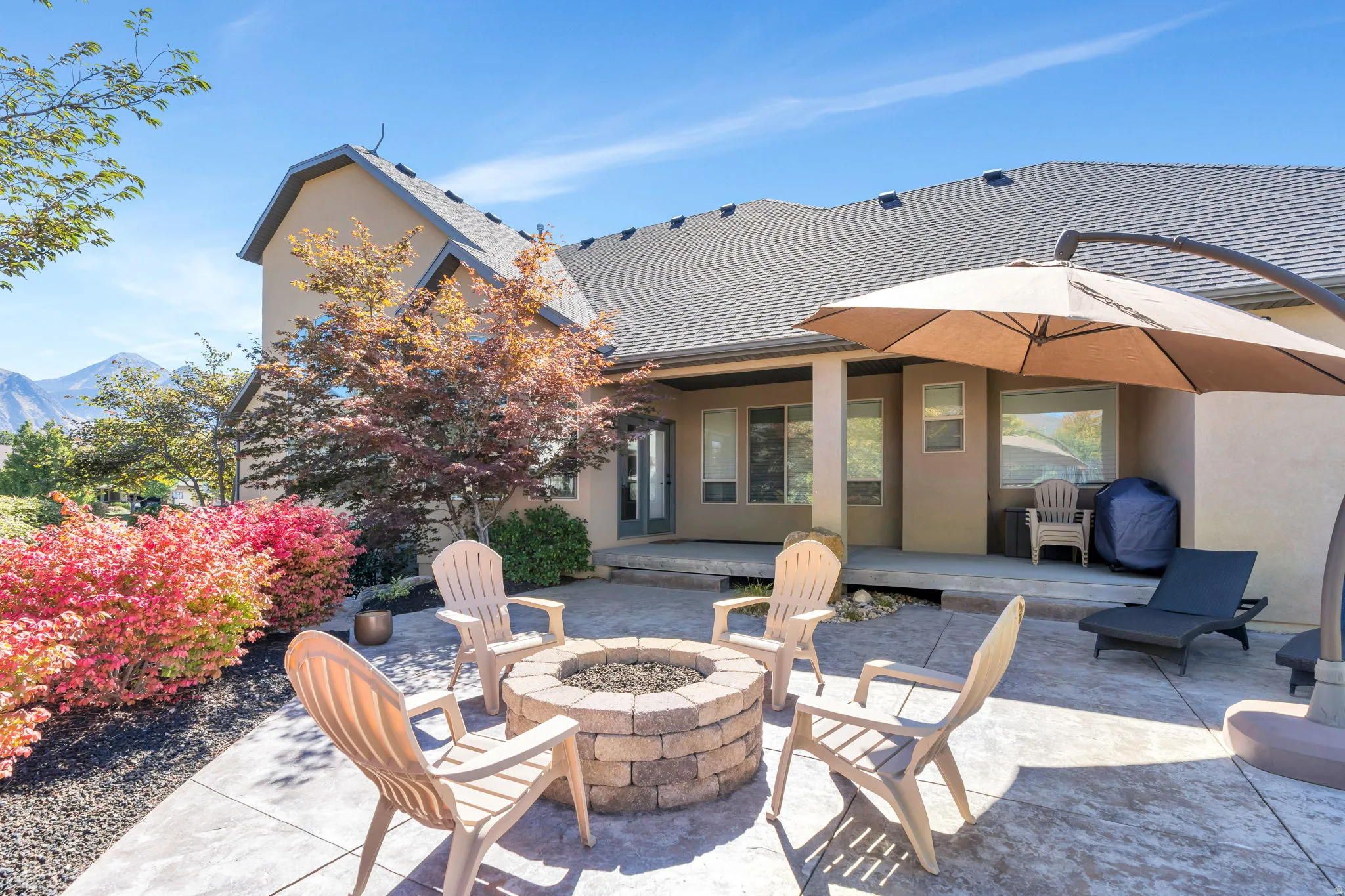 View of patio / terrace with an outdoor fire pit and a mountain view