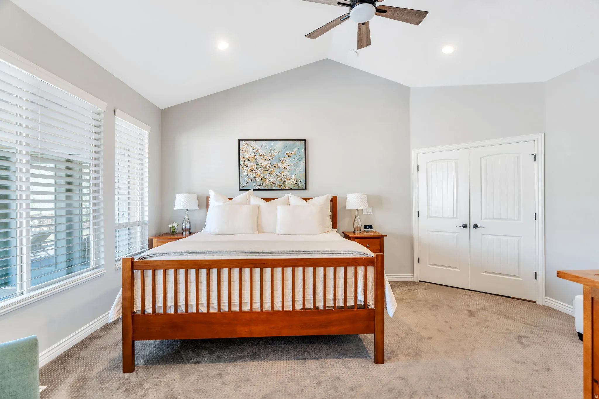 Master Bedroom featuring carpet flooring, a ceiling fan, vaulted ceiling, a  walk-in closet, and recessed lighting