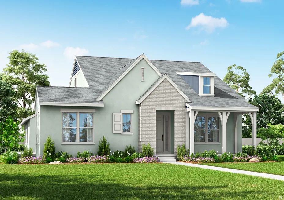 View of front of house featuring a front yard, stucco siding, a shingled roof, and brick siding