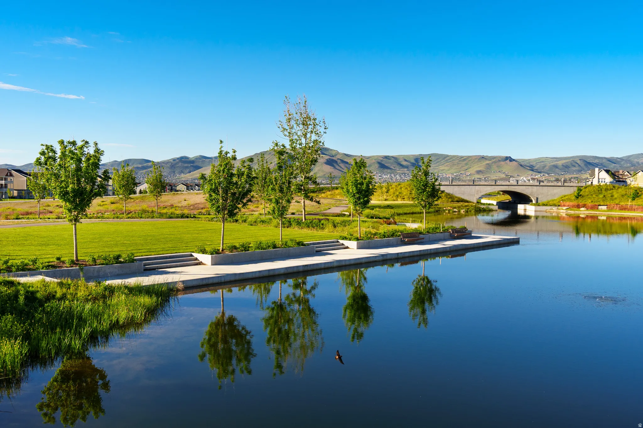 Water view featuring a floating dock and mountains