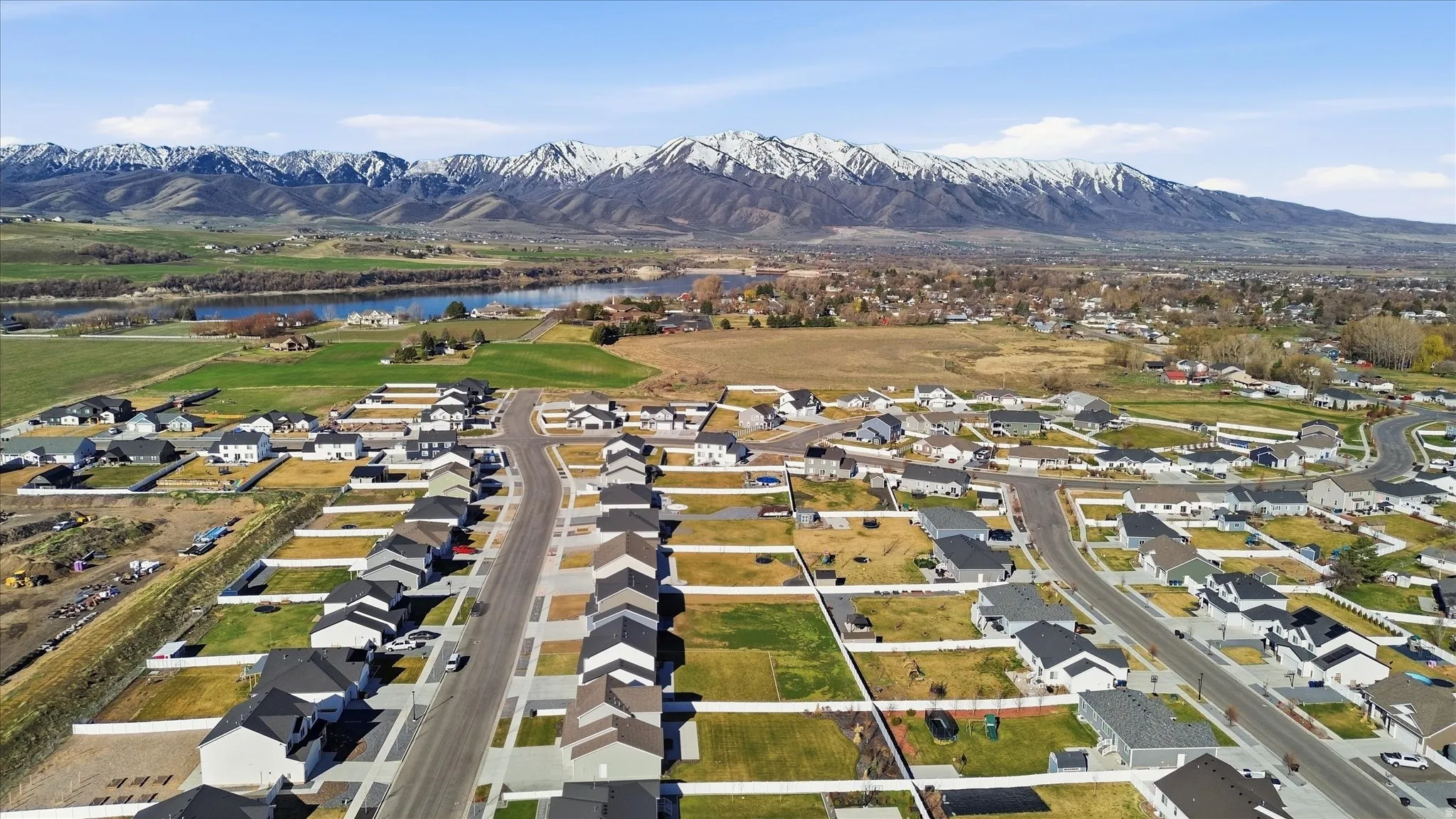 Aerial view of residential area featuring a water and mountain view