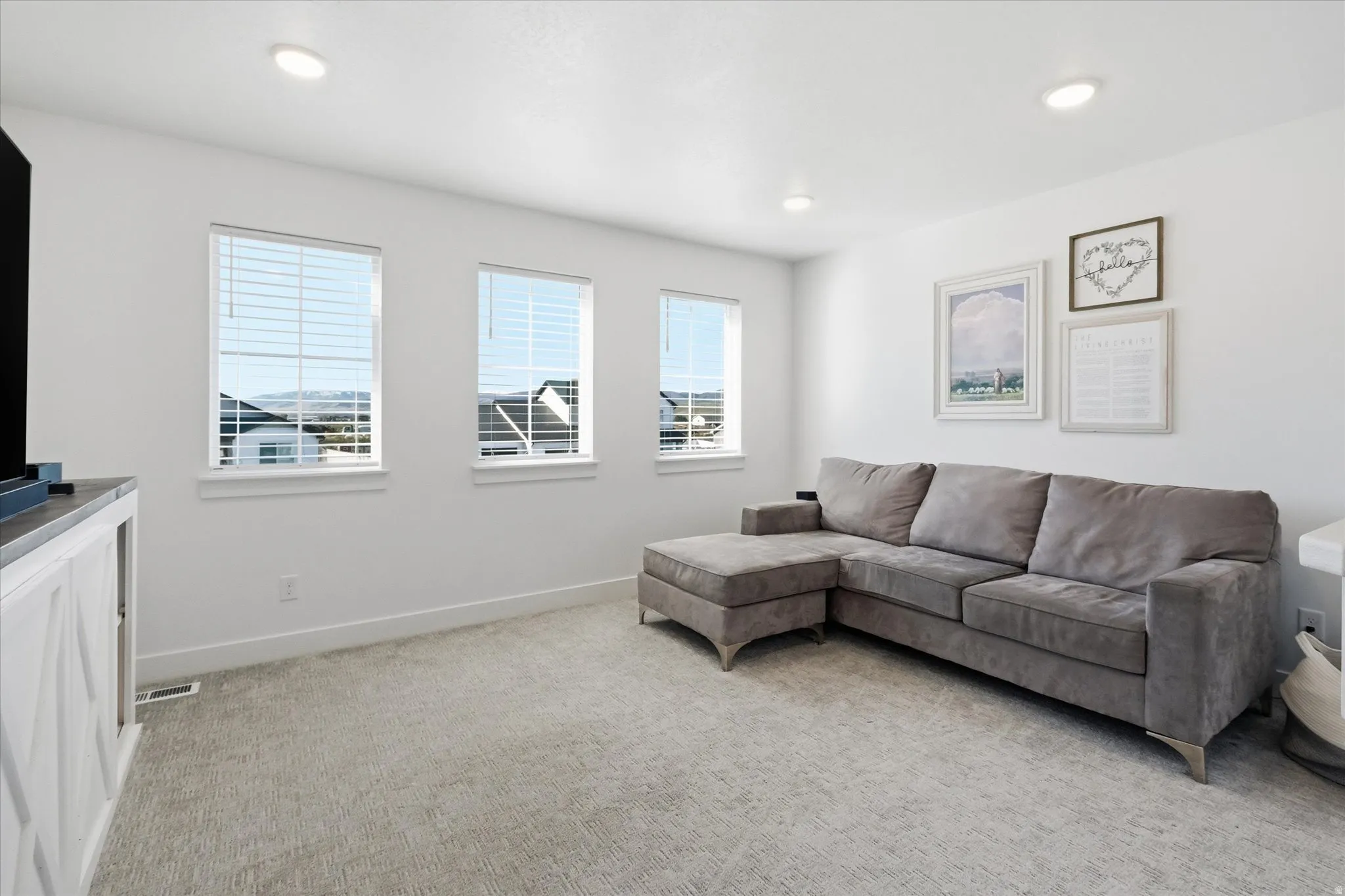 Upstairs Living room featuring light colored carpet and recessed lighting