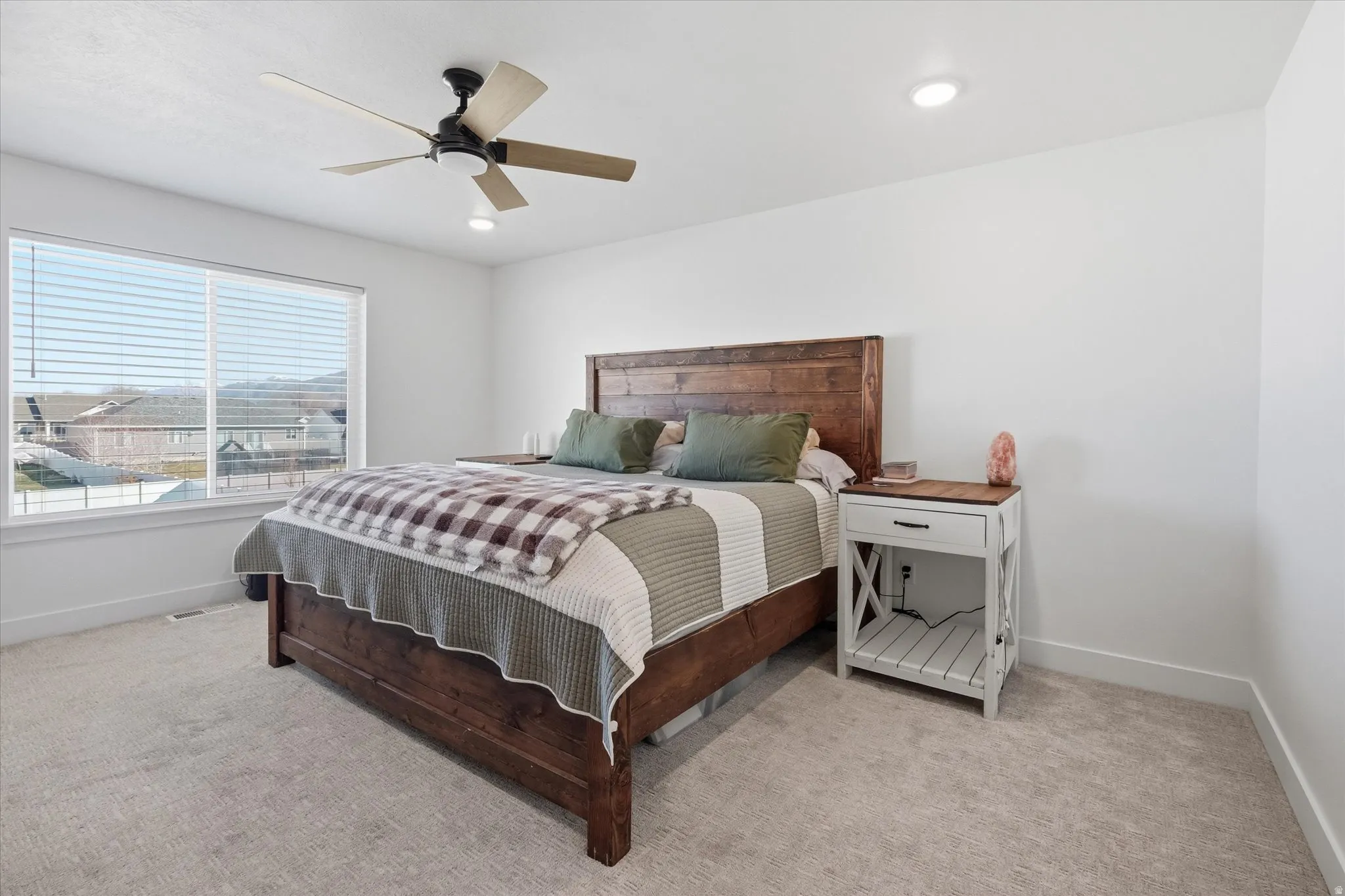 Primary Bedroom featuring light carpet, ceiling fan, and recessed lighting