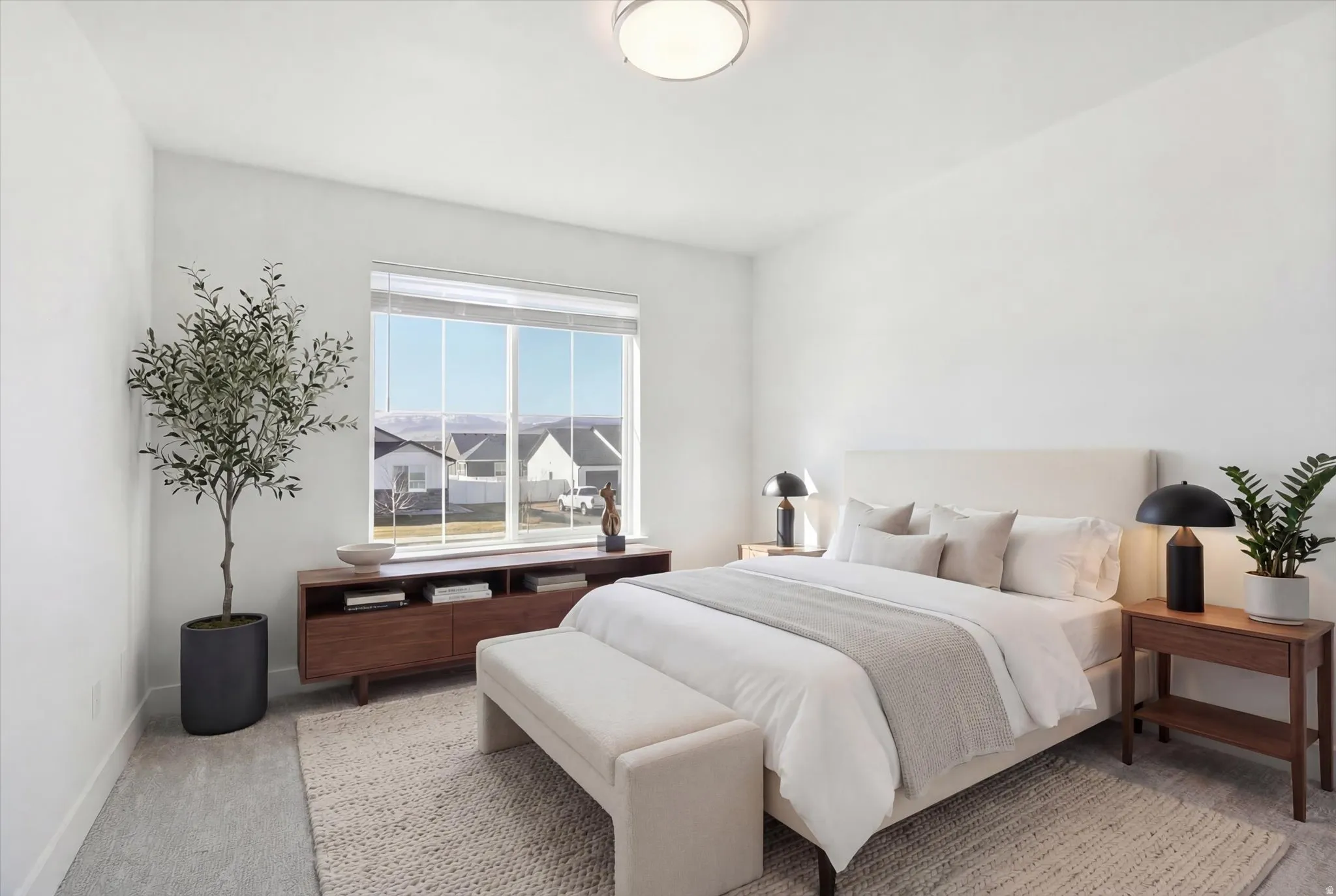 Bedroom 3 featuring light carpet and baseboards