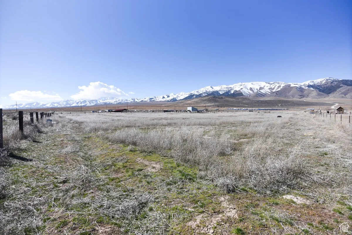 View of mountain backdrop with rural landscape
