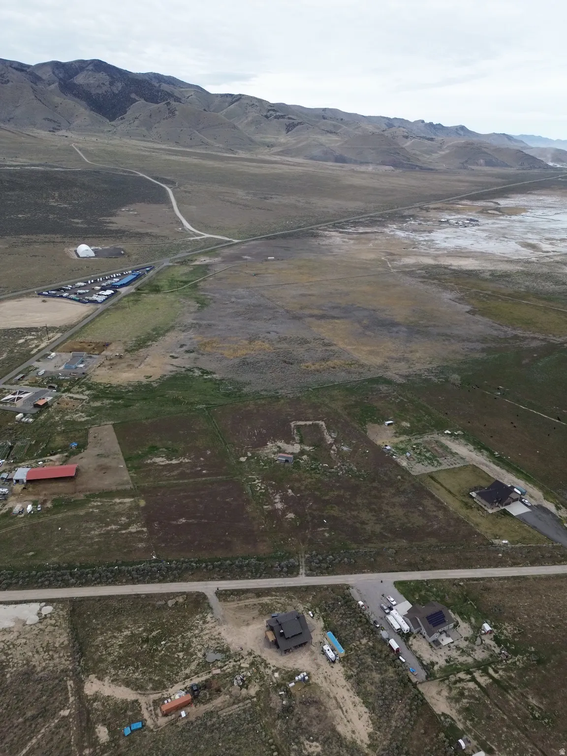 View of property location featuring a mountain backdrop and rural landscape