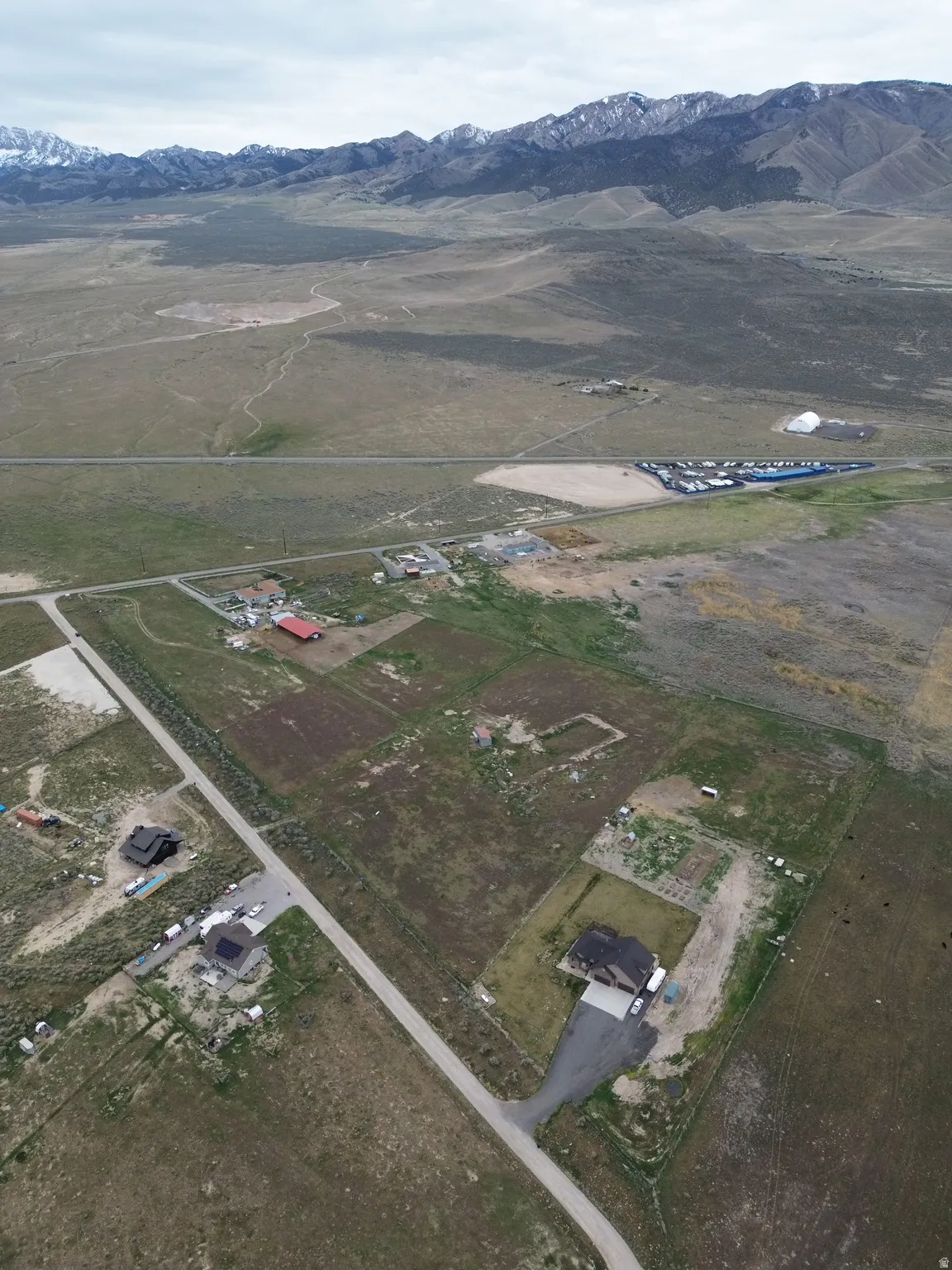View of property location featuring a mountainous background and rural landscape