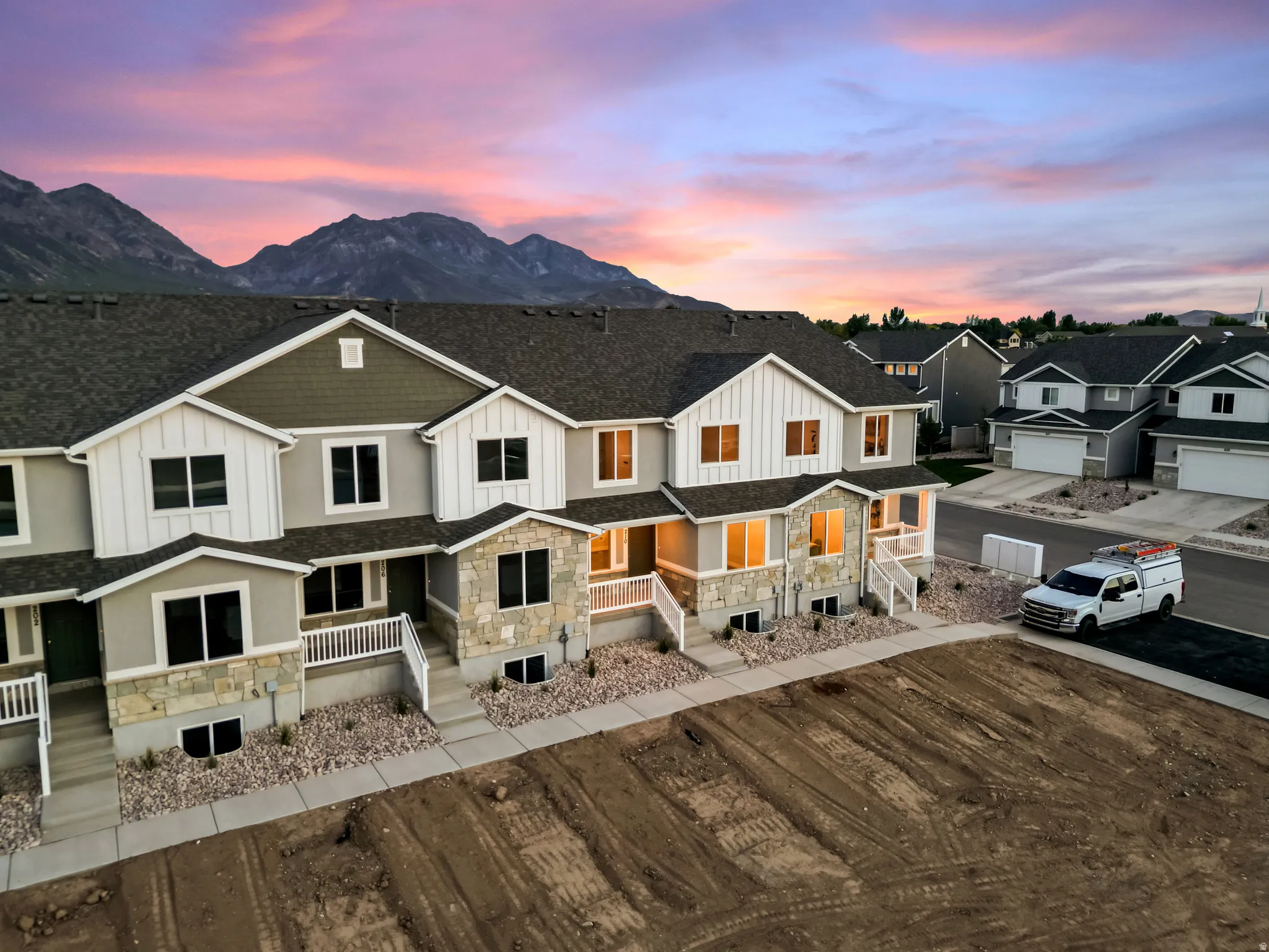 Modern townhomes with stone and siding exteriors