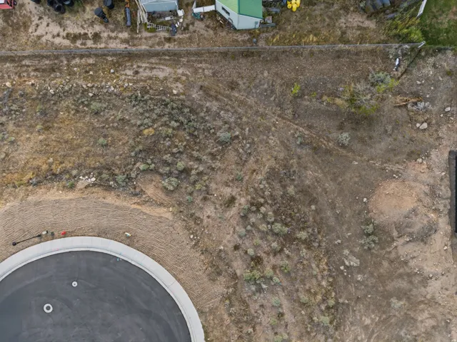 Circular asphalt cul-de-sac with concrete curbing