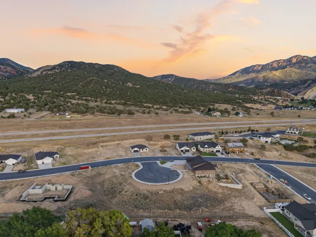 Residential development featuring paved roadways and mountain terrain