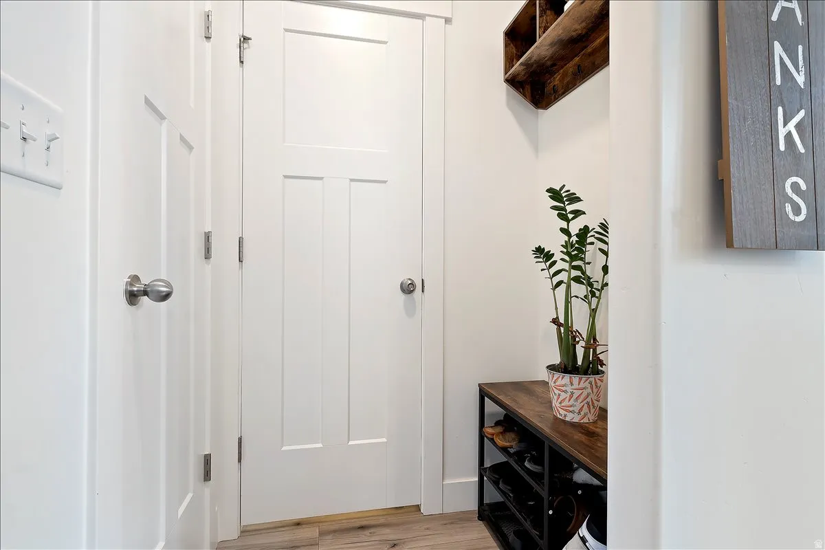 Mudroom featuring light wood-style floors