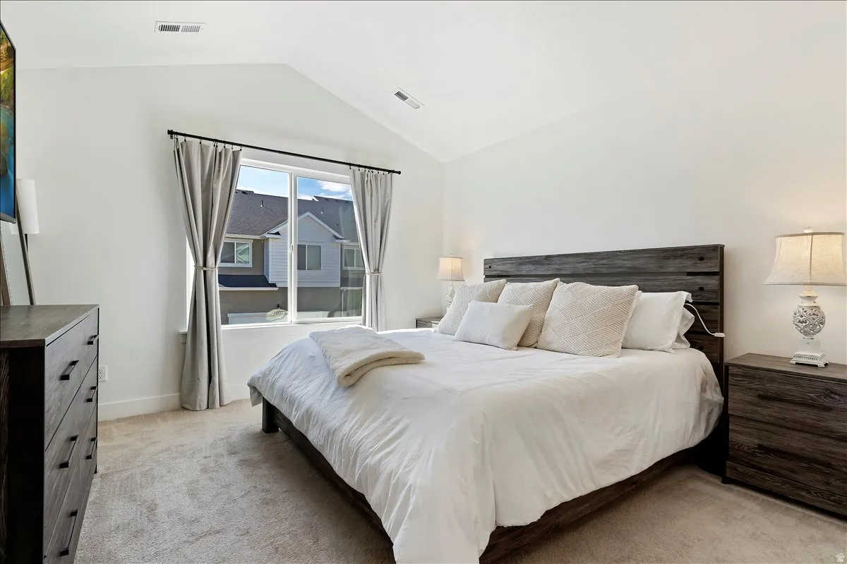 Bedroom with light carpet
