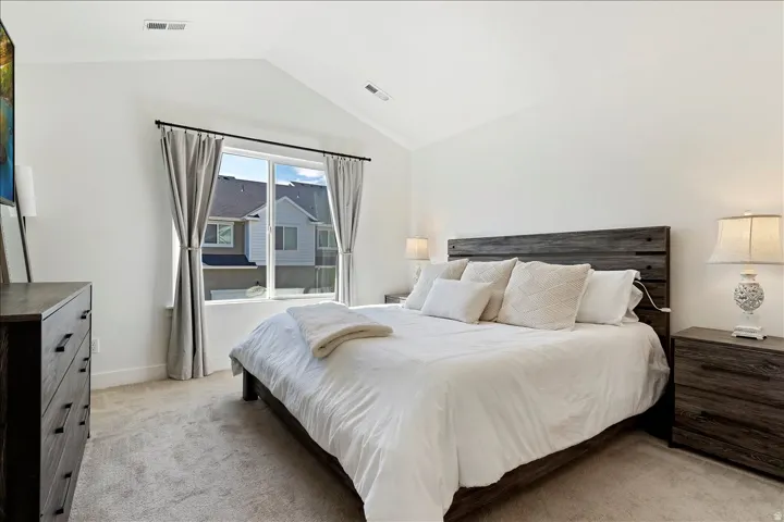 Bedroom with light carpet