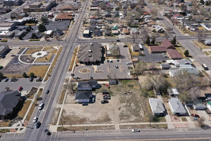 Aerial view of property's location featuring nearby suburban area