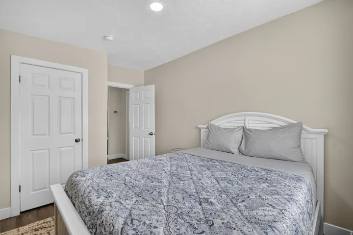 Unit 1: Recessed ceiling lighting, durable wood-finish flooring, and crisp white trim