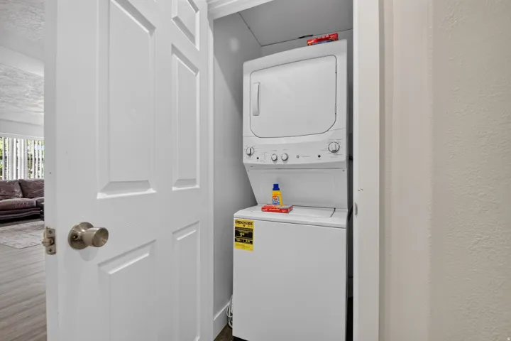 Unit 1: Dedicated laundry closet with a stackable washer and dryer