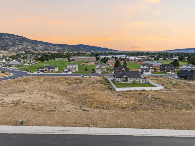 Expansive lot with mountain backdrop and paved street access