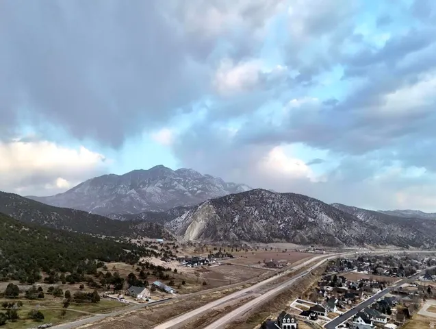 View of mountain backdrop with nearby suburban area