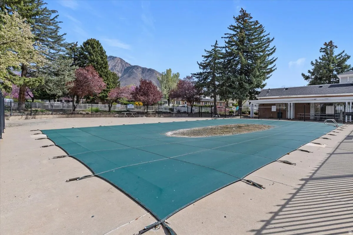 Community pool featuring a mountain view