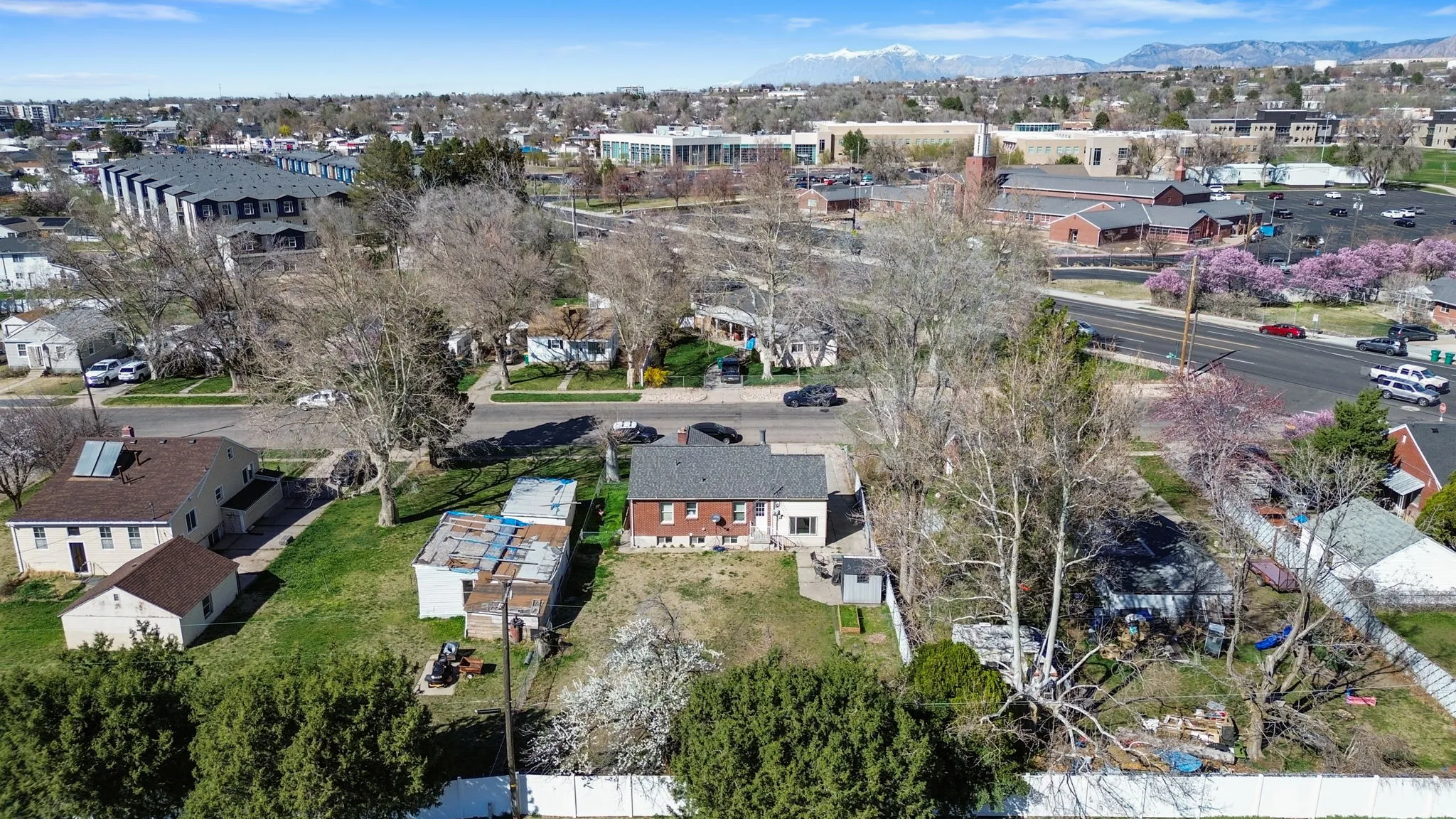 Aerial perspective of suburban area featuring Clearfield Aquatic Center, North Davis Junior High, and LDS Church