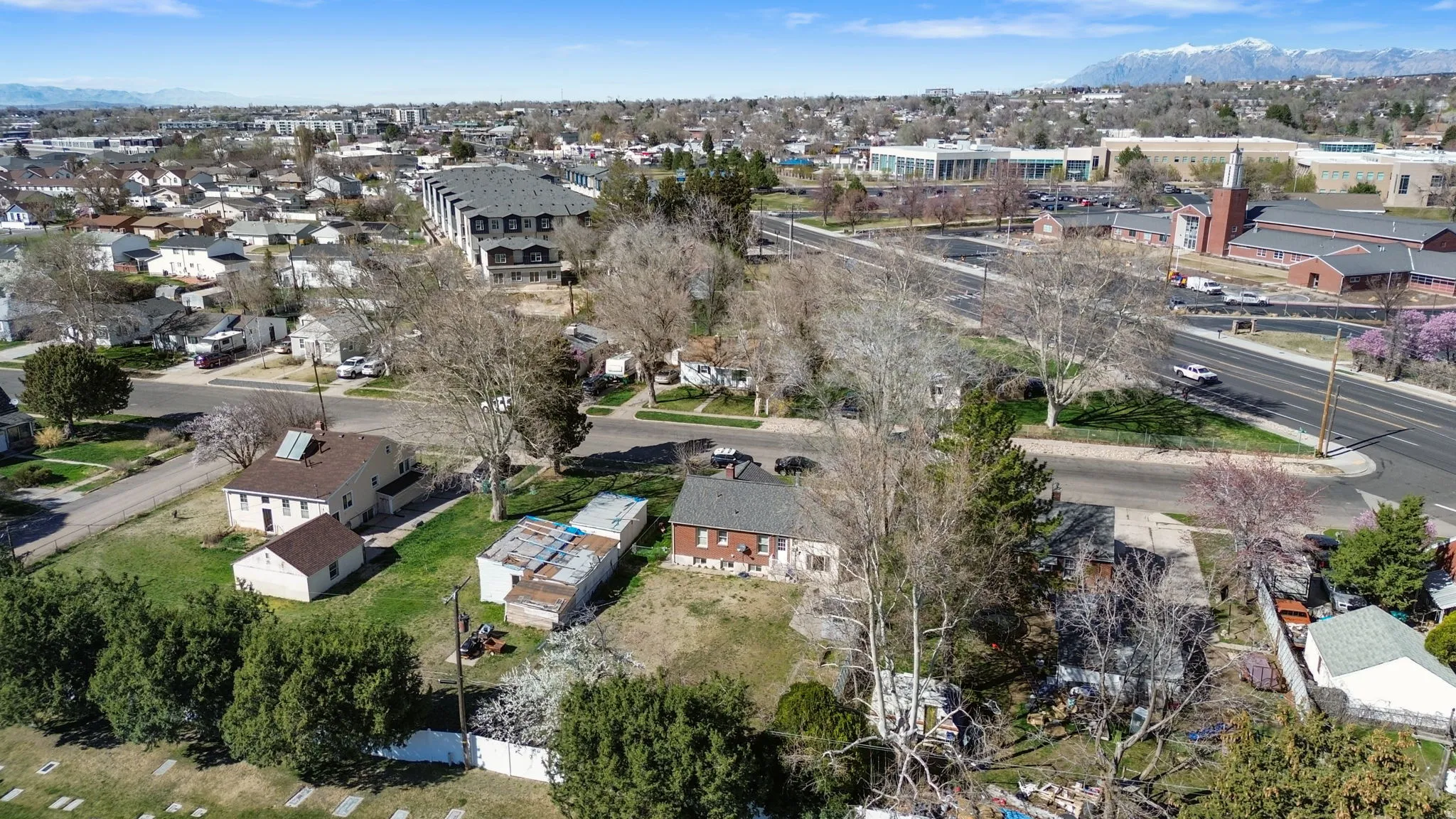 Aerial perspective of suburban area featuring Clearfield Aquatic Center, North Davis Junior High, and LDS Church
