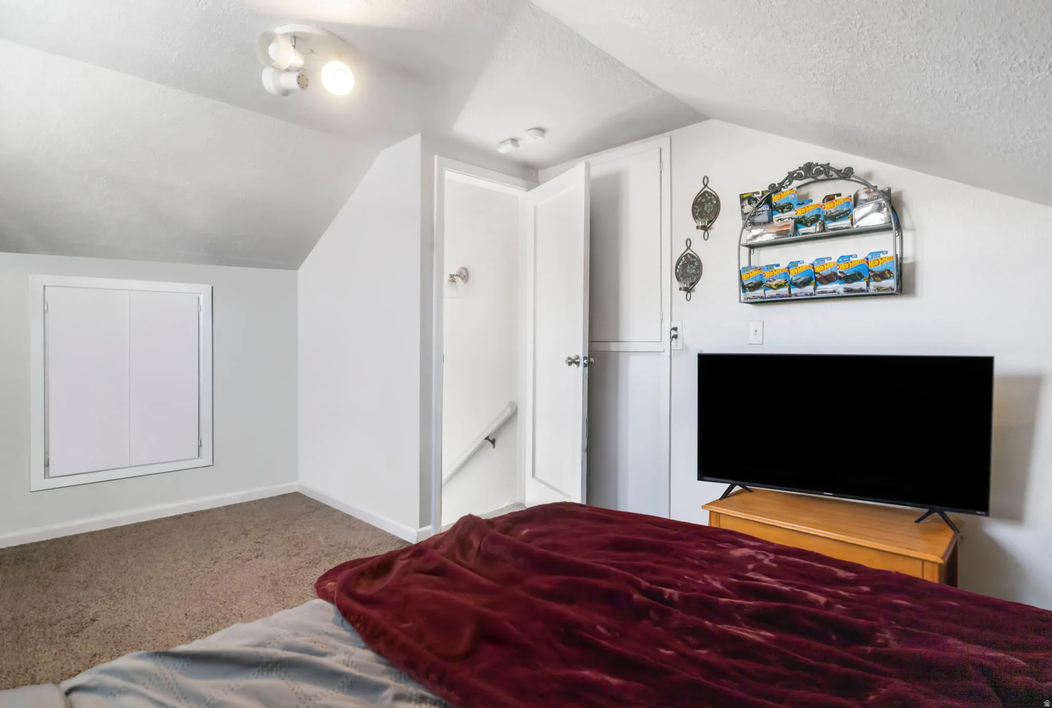 Carpeted bedroom 3 featuring a textured ceiling