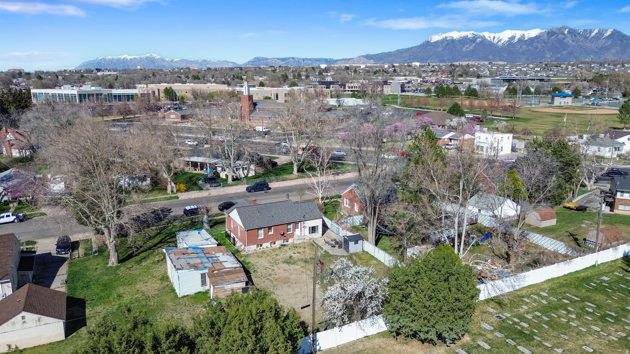 Aerial perspective of suburban area featuring Clearfield Aquatic Center, North Davis Junior High, and LDS Church