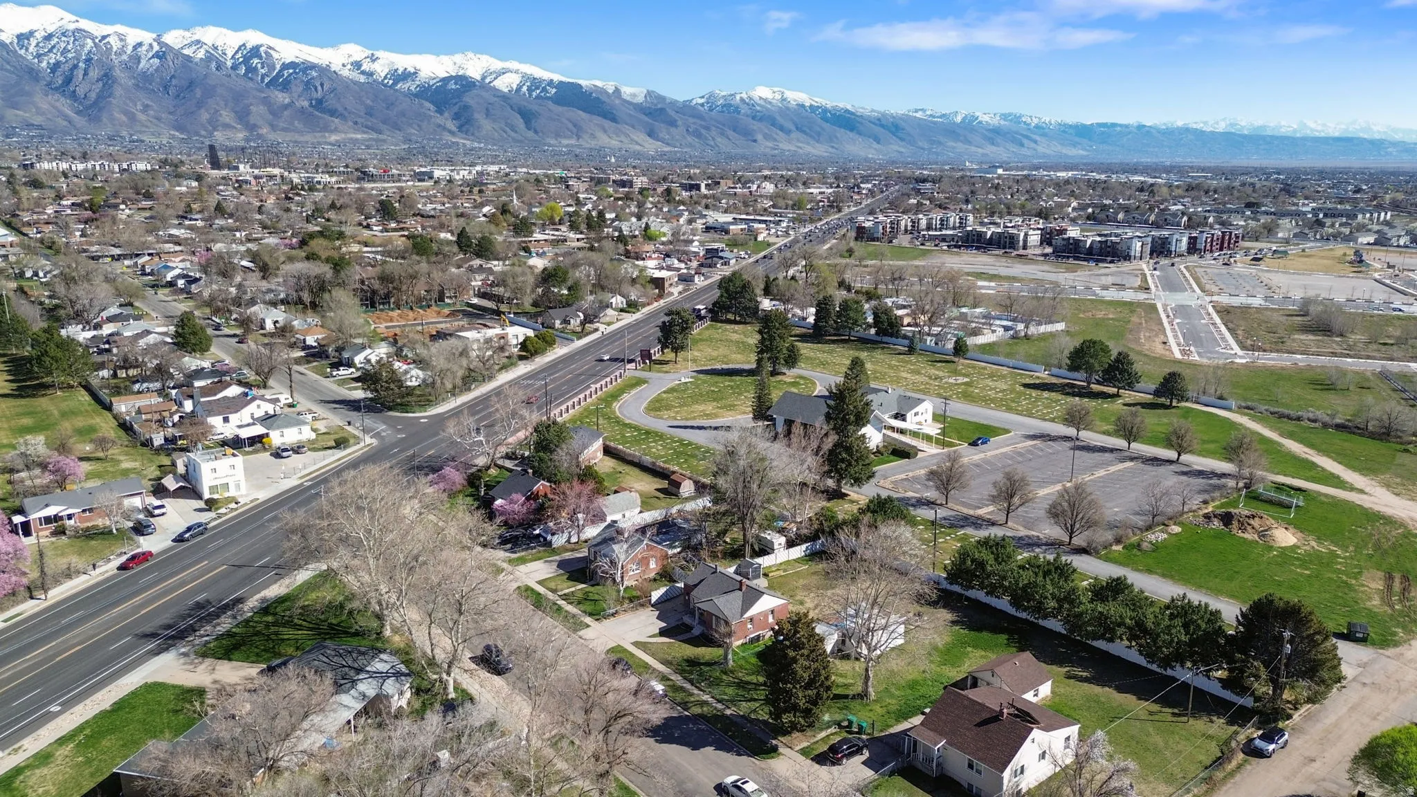 Aerial perspective of suburban area with a mountain backdrop