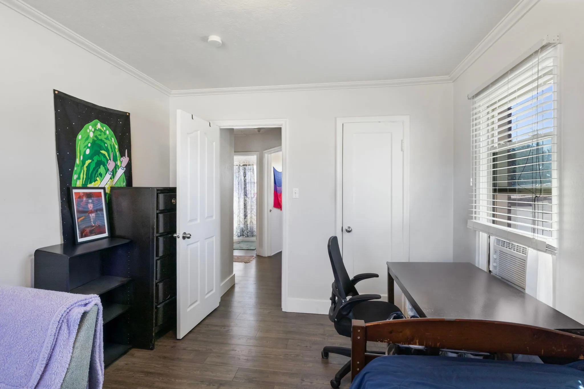 Bedroom 2 featuring a desk, dark wood finished floors, and ornamental molding