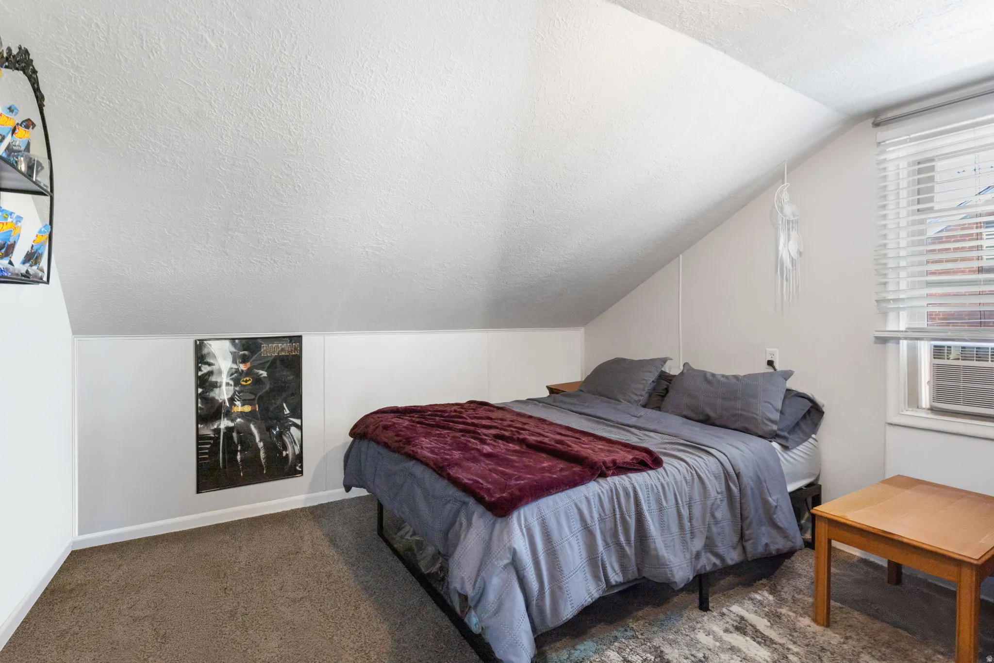 Bedroom 3 with dark colored carpet and cooling unit