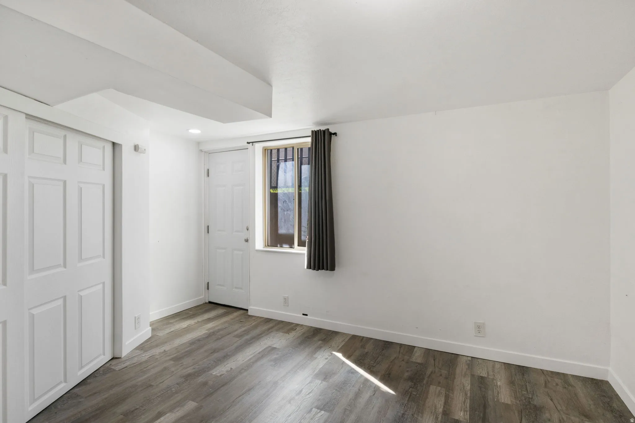 Bedroom 1 with outside entrance to private backyard