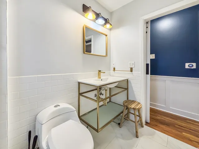Bathroom with wainscoting and vanity