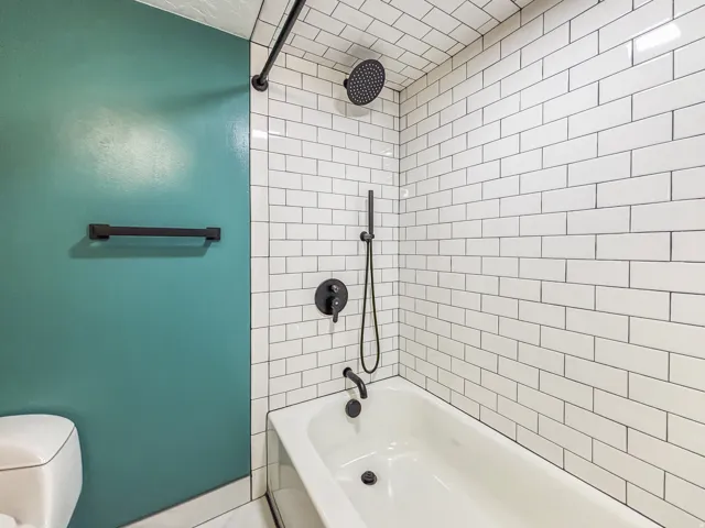 Full bathroom featuring bathtub / shower combination and toilet