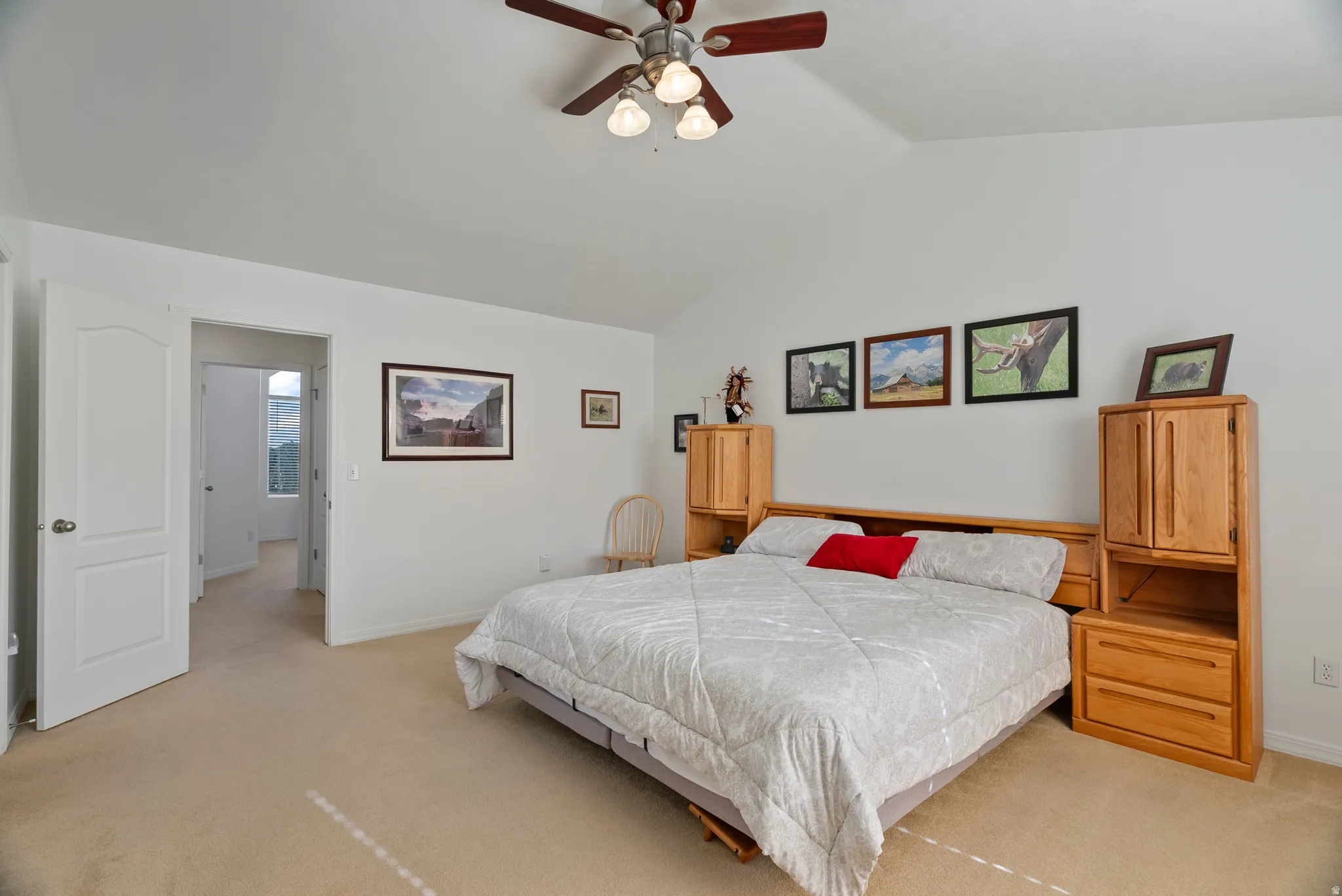 Bedroom with light carpet and ceiling fan