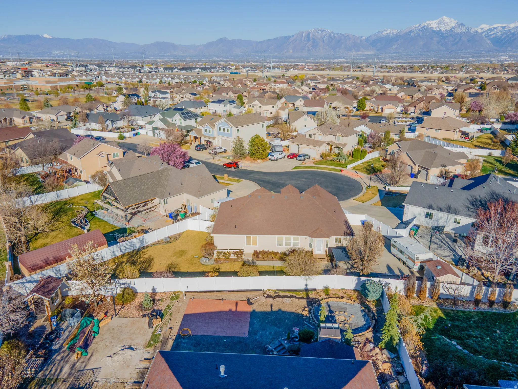 Aerial perspective of suburban area featuring a mountainous background