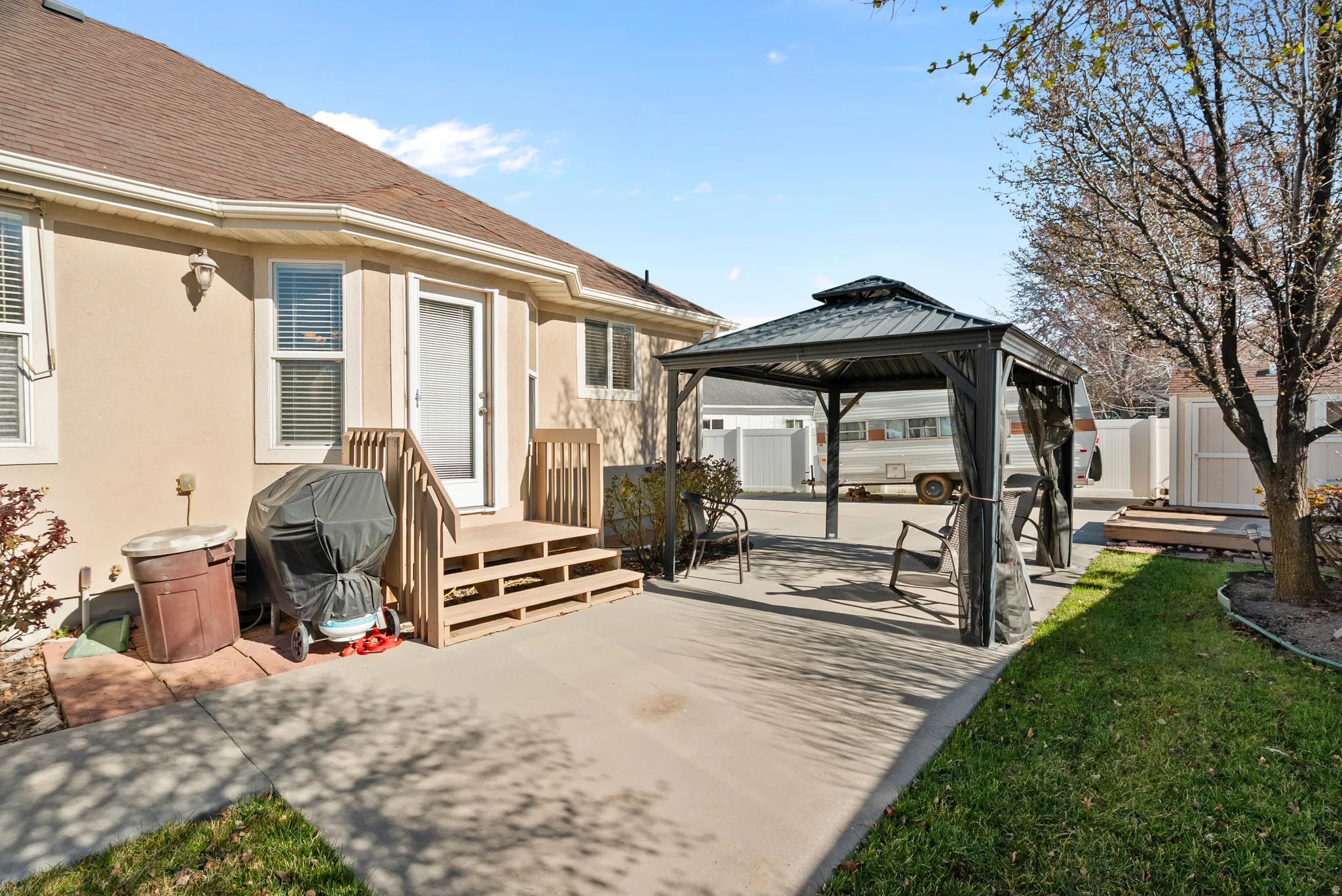 View of patio / terrace featuring a gazebo, a shed, and area for grilling