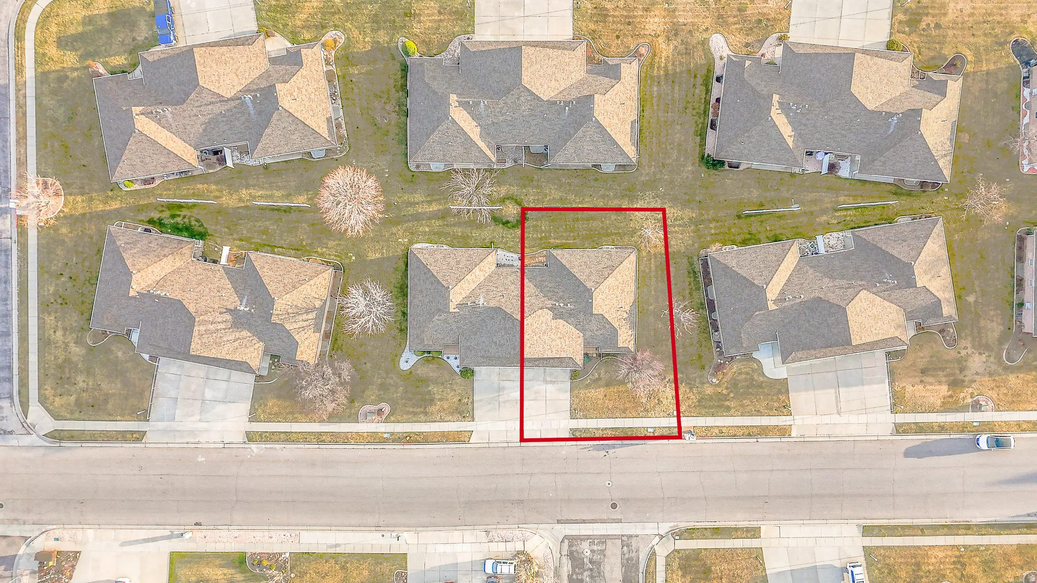 Aerial perspective of suburban area with property boundaries highlighted